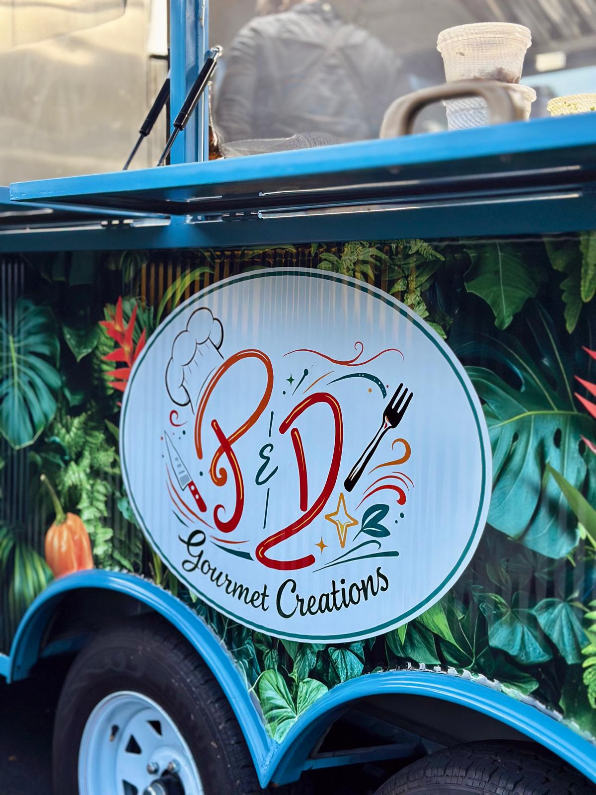 The P&D Gourmet Creations food trailer with its hand-painted logo